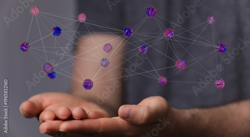Hand holding a network of s...
