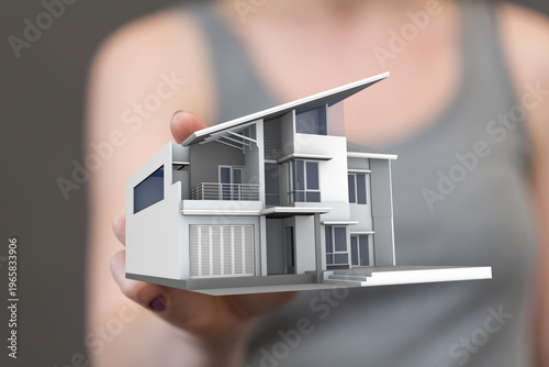 A person holding a miniatur...