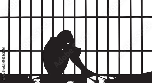 Silhouette of a person sitting in a prison cell bars