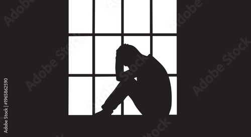 Silhouette of a person sitting in front of a window with a grid pattern
