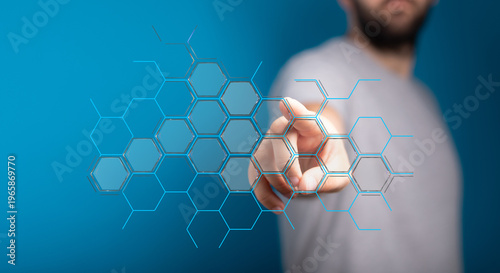 Hand touching digital hexag...