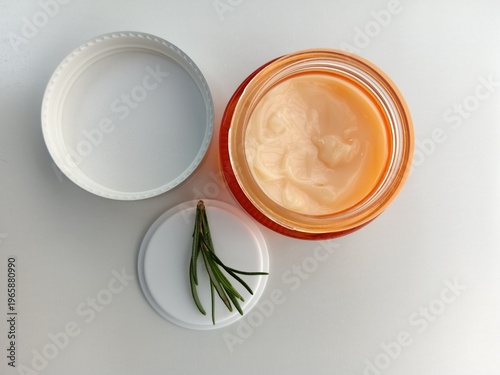 Fotografie Organic Face Moisturizer with Herbal Extract and White Lid Flat Lay