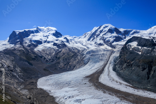 Mountain panorama with Monte Rosa massif with summit Dufourspitze, glacier Grenzgletscher and mountain Lyskamm in Pennine Alps, Switzerland