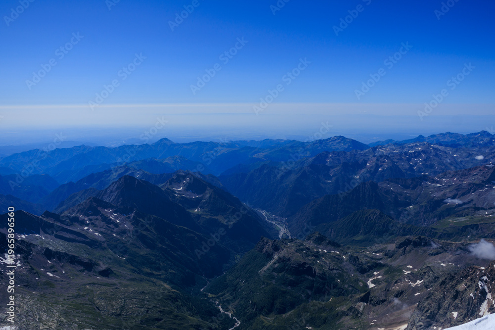 Fototapeta premium Mountain panorama of Pennine Alps mountains seen from summit Signalkuppe, Italy