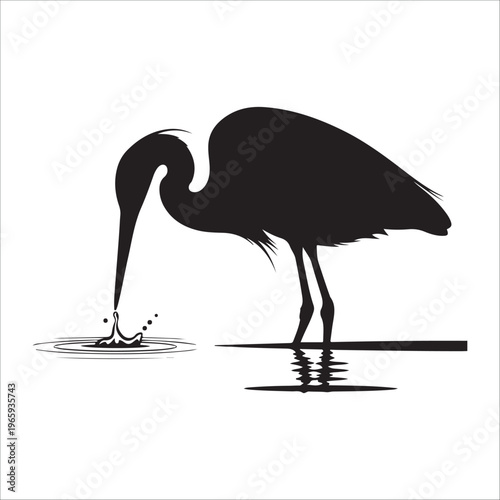 Silhouette of a heron catching fish in water with ripples