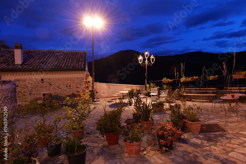 The small square in Rocca Imperiale, a small town in Calabria in the early evening, Italy.