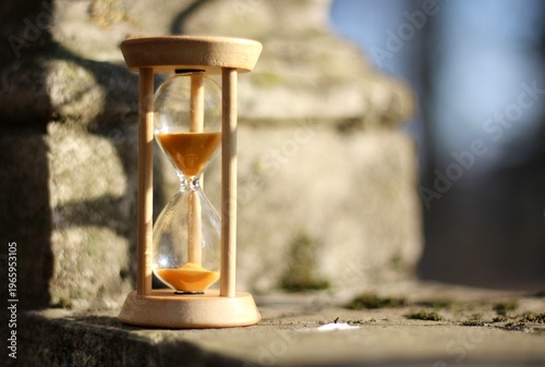 Old park and hourglass time is passing concept hurry up be in time old and modern 