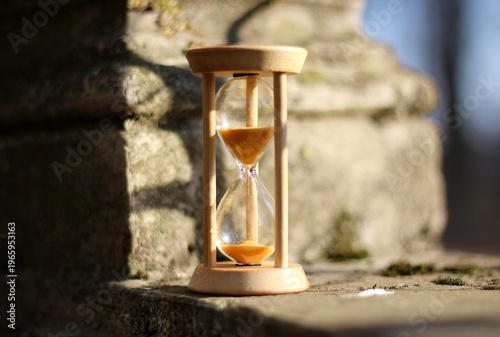 Old park and hourglass time is passing concept hurry up be in time old and modern 