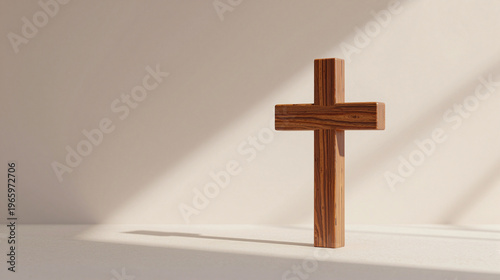Wooden cross sitting on top of a white table.