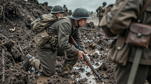 Group of soldiers in World War I uniforms in muddy terrain.