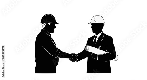 Silhouette of two businessmen wearing helmets shaking hands