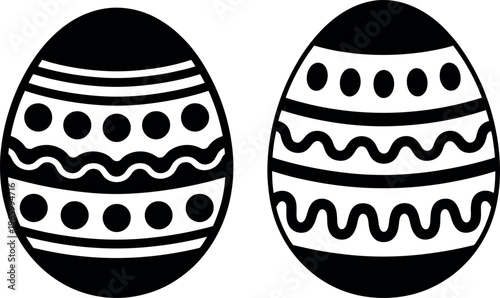 Two intricately decorated eggs featuring contrasting black and white patterns.
