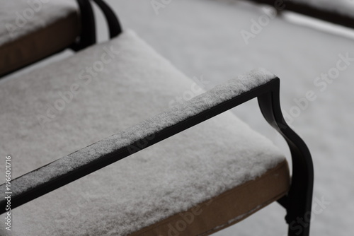 Quadro em tela dusting of snow on iron patio chair (macro, close-up, seasonal)