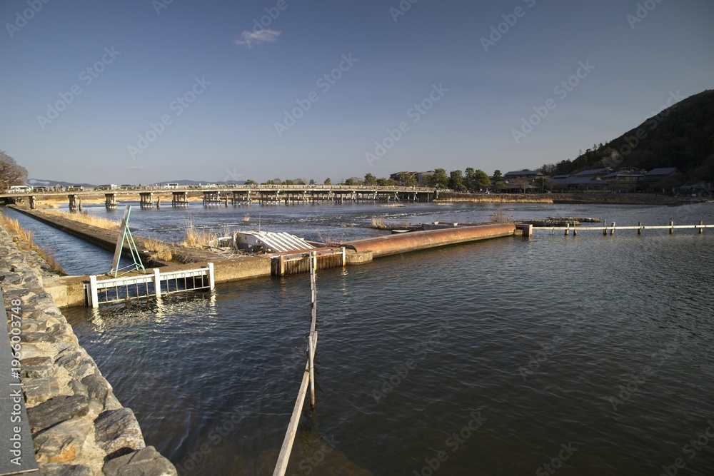Fototapeta premium Calm inlet with piers and stone embankment