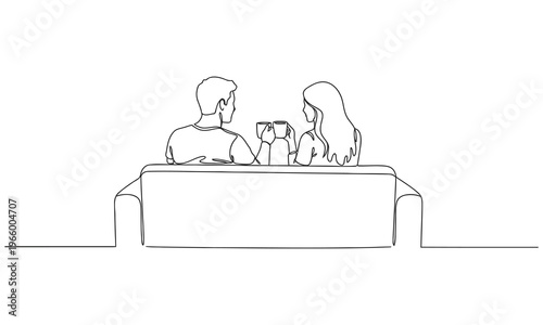 Single one line drawing back view romantic couple sitting at sofa, talking and drinking coffee. Man and woman have relaxing day off