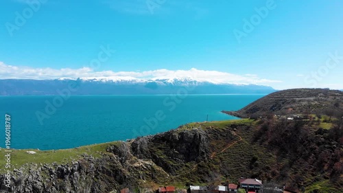 Village of Lin on the Rocky Peninsula Edge Along the Beautiful Shoreline of Lake Ohrid surrounded by emerald calm waters