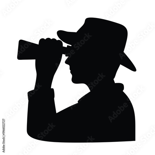 Silhouette of a man in a hat using a telescope intensely scanning