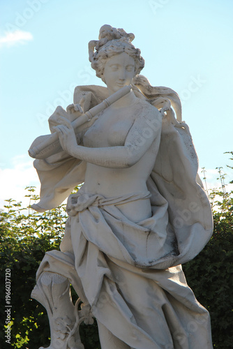 Photography statue of the muse euterpe in the gardens of a baroque palace (lower belvedere)
