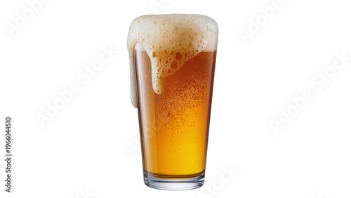 Fotografia Golden amber beer in a tall pint glass with overflowing frothy white foam drippi