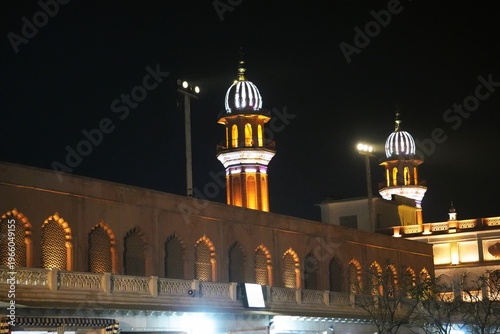Mosque Minaret and Building Illuminated at Night Scene