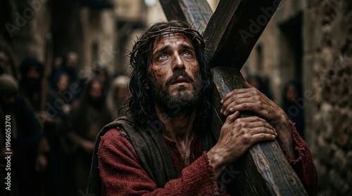 Jesus carrying wooden cross on way to crucifixion. Man wearing crown of thorn with blood on face. Easter religious scene of suffering, sacrifice and resurrection. Biblical event art.