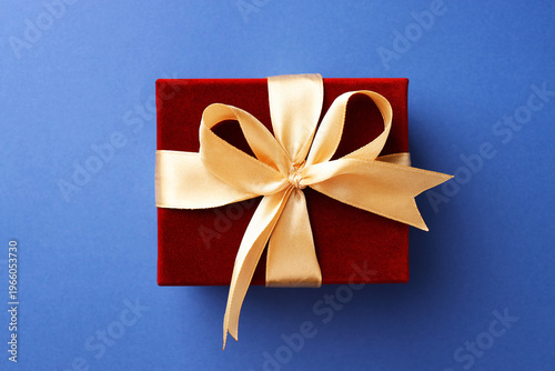 Beautiful velvet gift box on blue background, top view
