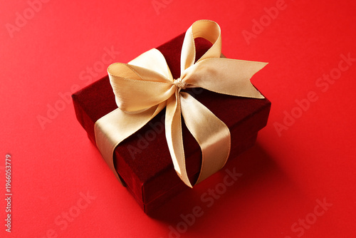 Beautiful velvet gift box on red background, closeup