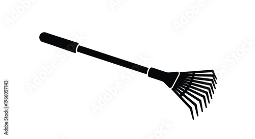 A black silhouette of a garden rake against a white background
