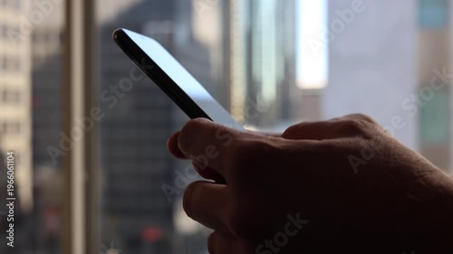 Two Handed Phone Action In Downtown