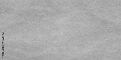 A high resolution neutral grey concrete wall texture with subtle imperfections and soft shading