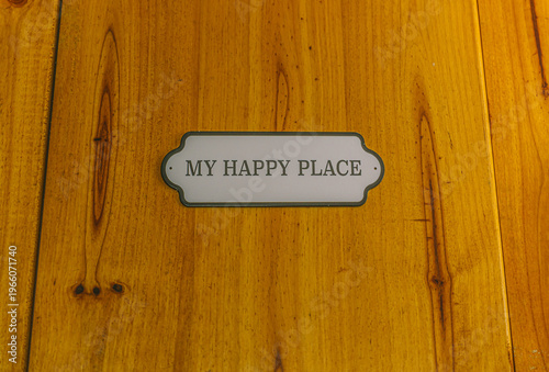 Wooden sign displaying my happy place text for comfort
