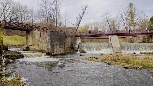 Scenic view of Belmont Falls in Vilnius, Lithuania, cascading waterfall surrounded by lush greenery, natural landscape. French built a flour mill. 4K video footage