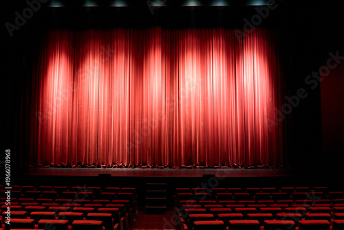 Empty stage with red curtain and spotlights