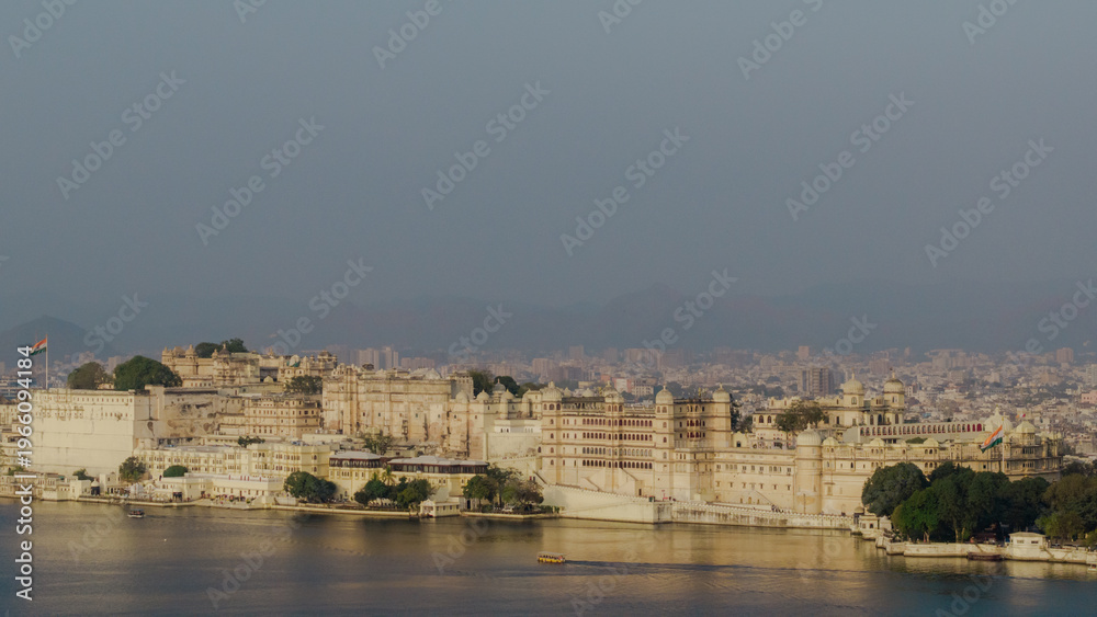 Fototapeta premium Drone View of City Palace Udaipur on Lake Pichola India Aerial Perspective of Royal Heritage Architecture with Scenic Rajasthan Cityscape