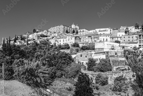 Caceres, Extremadura, Spain: Panoramic skyline of the old town of Caceres up on a hill top in black and white