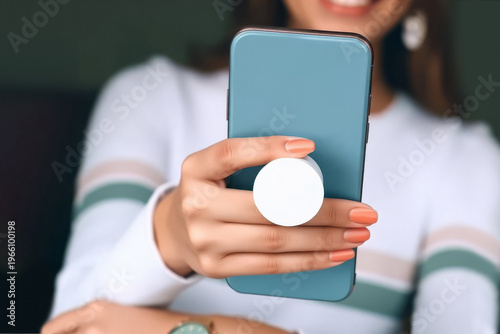 Woman holding blue phone with white pop socket mockup, ai generated. Empty circle glue button on smartphone for hold mock up. Mobile cover with adhesive popgrip template.