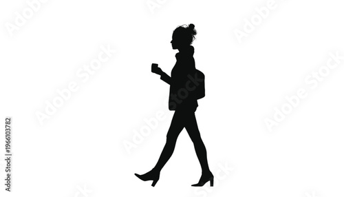 Silhouette of a professional woman walking with a purse and holding a small object in her hand.