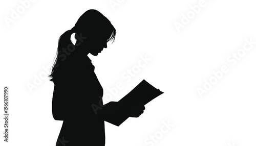 Businesswoman silhouette profile examines documents or papers held in both hands against white.