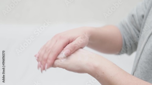 Female hands apply cream to hands