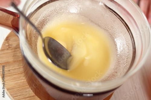 Melting butter. Making frozen strawberry cheesecake series.