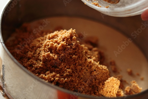 Transfer cookies mixture into baking pan. Making frozen strawberry cheesecake series.