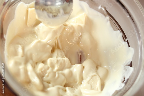 Melting white chocolate. Making frozen strawberry cheesecake series.