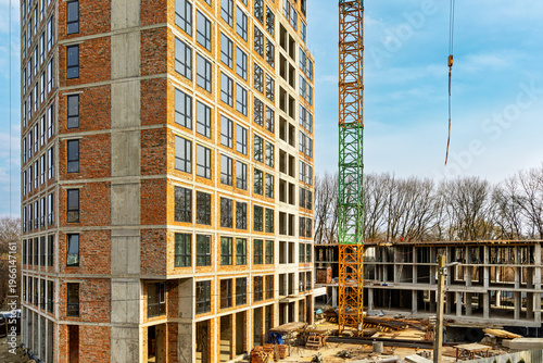 Fotografie High Rise Building Under Construction With Crane