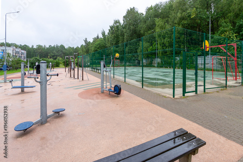 Empty outdoor gym in park on rainy day, loneliness and solitude concept