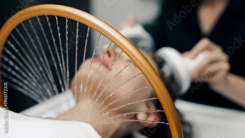 Japanese scalp spa with professional device in modern luxury wellness salon.
