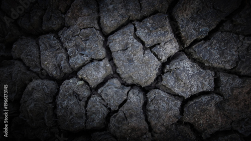 Quadro em tela Dry cracked earth texture background in dark tone