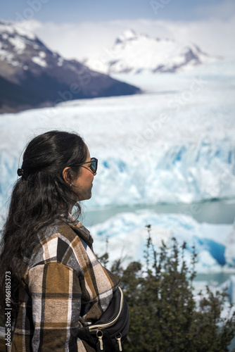 Tourist woman watching Perito Moreno Glacier in Patagonia Argentina