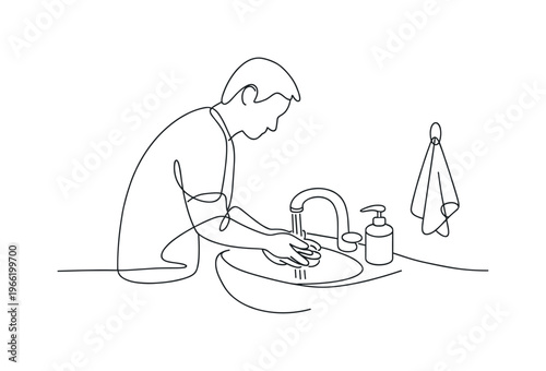 Мытье рук. чPerson standing at a bathroom sink washing hands under running water, soap dispenser placed beside the faucet, small