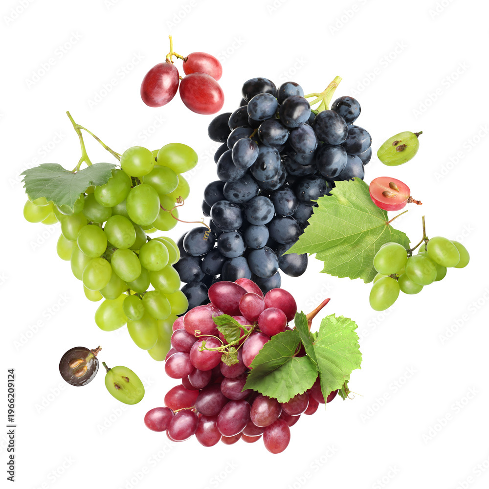 Fototapeta premium Fresh grapes and green leaves falling against white background