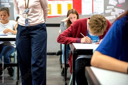 Students focused during classroom exam.